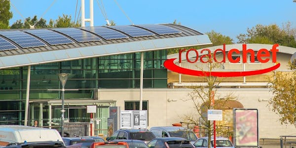 Photo of Roadchef Norton Canes, underneath blue sky with vehicles in car park