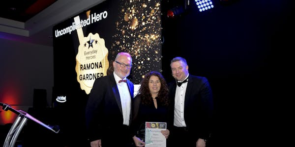 Ramona Gardner is awarded by Roadchef CEO Mark Fox and Operations Director Peter Cossar with the Roadchef Uncomplicated Hero of the Year Prize